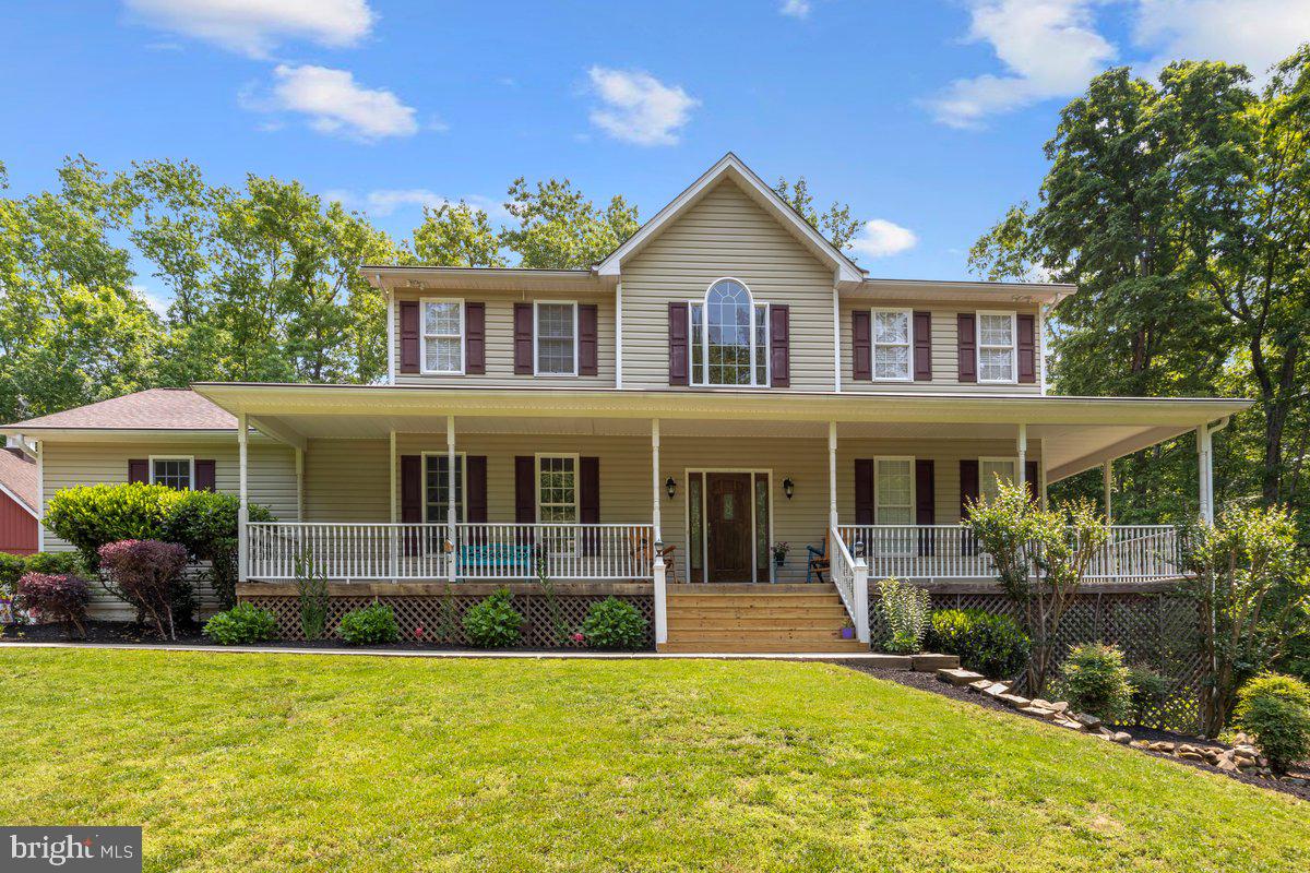 18326 Dogwood Trail Drive Jeffersonton, VA 22724 - Photo 1 of 49 a front view of a house with a yard