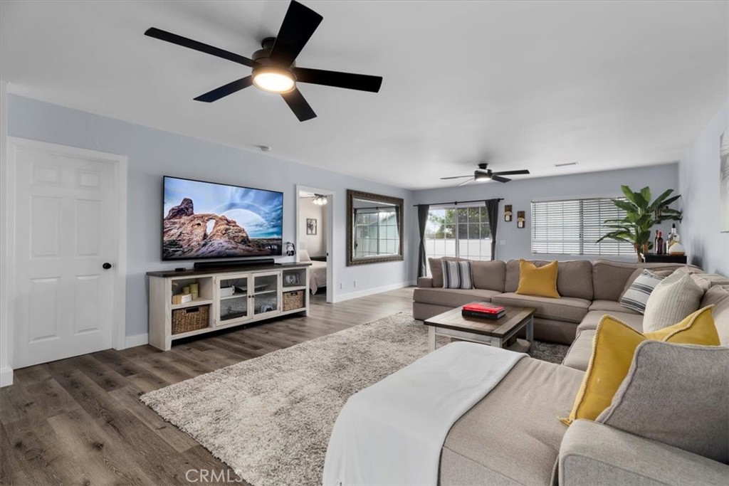 338 East 219th Street Carson, CA 90745 - Photo 11 of 36 a living room with furniture and a flat screen tv