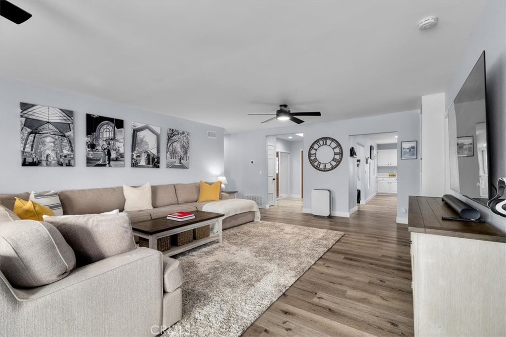 338 East 219th Street Carson, CA 90745 - Photo 12 of 36 a living room with furniture a flat screen tv and a wall