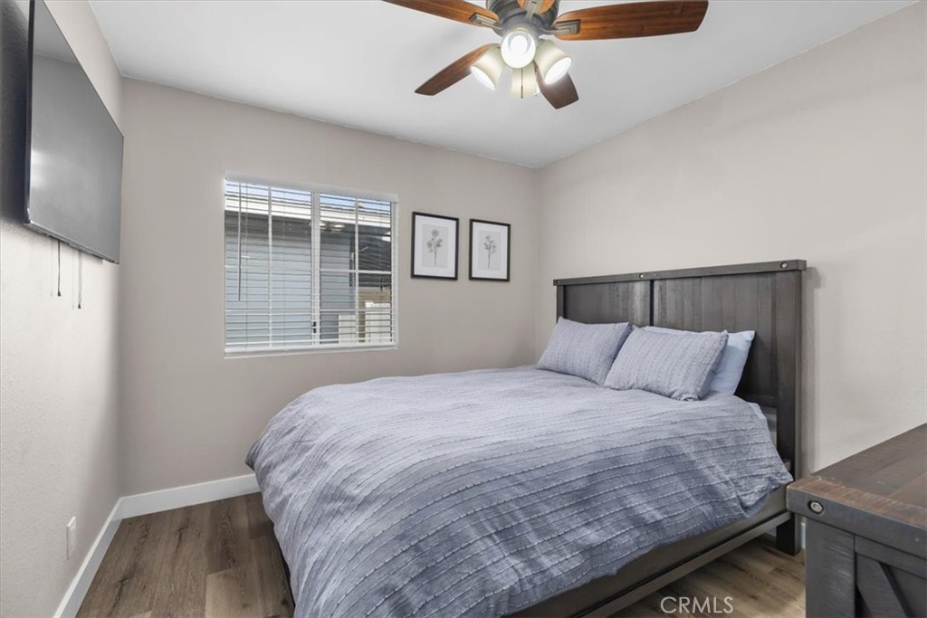 338 East 219th Street Carson, CA 90745 - Photo 16 of 36 a bedroom with a large bed and a window