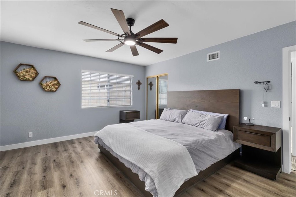 338 East 219th Street Carson, CA 90745 - Photo 21 of 36 a bedroom with a large bed and a window