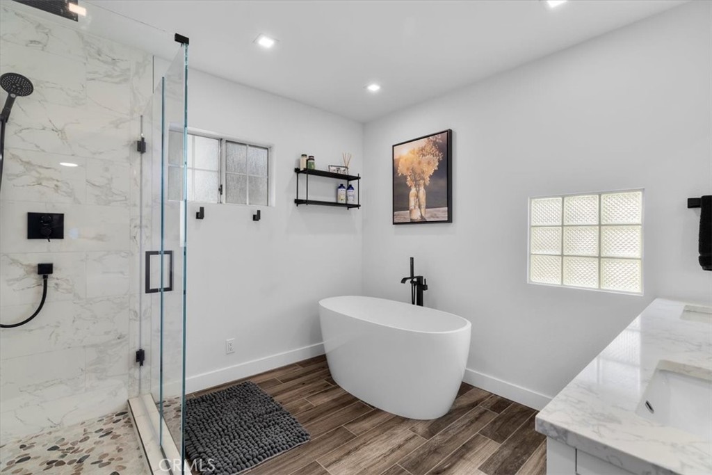 338 East 219th Street Carson, CA 90745 - Photo 24 of 36 a white bath tub sitting next to a shower