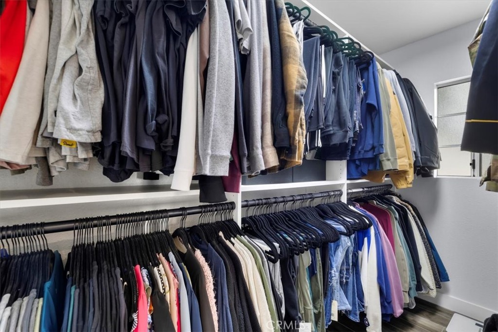 338 East 219th Street Carson, CA 90745 - Photo 26 of 36 a view of walk in closet with clothes and shoes