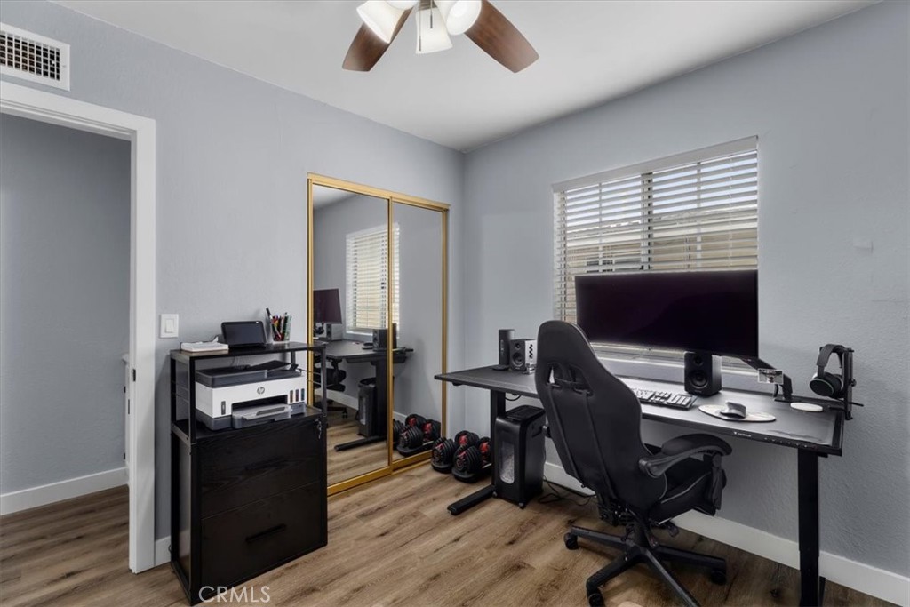 338 East 219th Street Carson, CA 90745 - Photo 27 of 36 a view of a workspace with furniture and a window