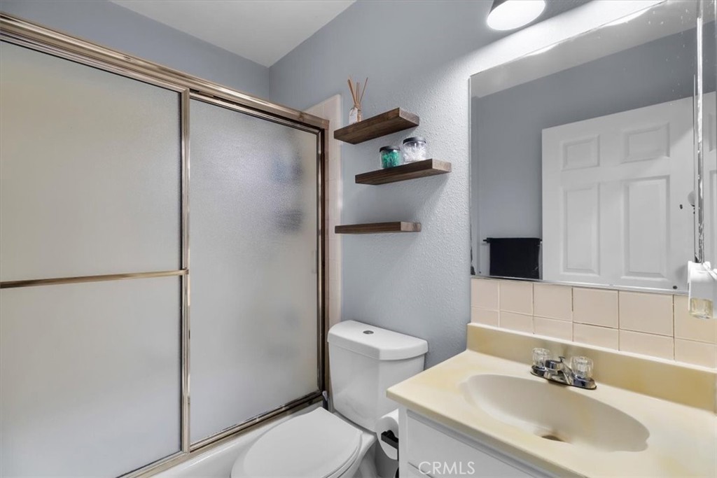 338 East 219th Street Carson, CA 90745 - Photo 29 of 36 a bathroom with a sink toilet and shower
