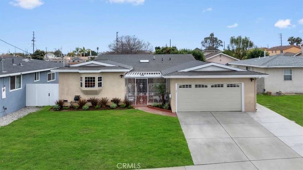 338 East 219th Street Carson, CA 90745 - Photo 33 of 36 a view of a house with a yard and potted plants