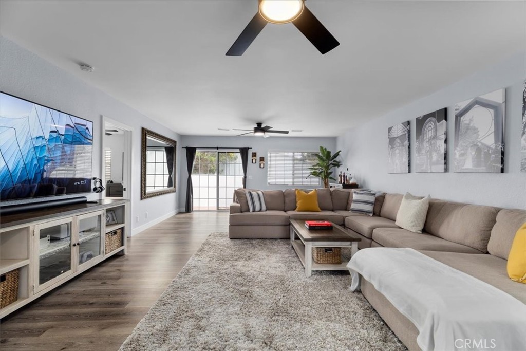 338 East 219th Street Carson, CA 90745 - Photo 9 of 36 a living room with furniture and a kitchen