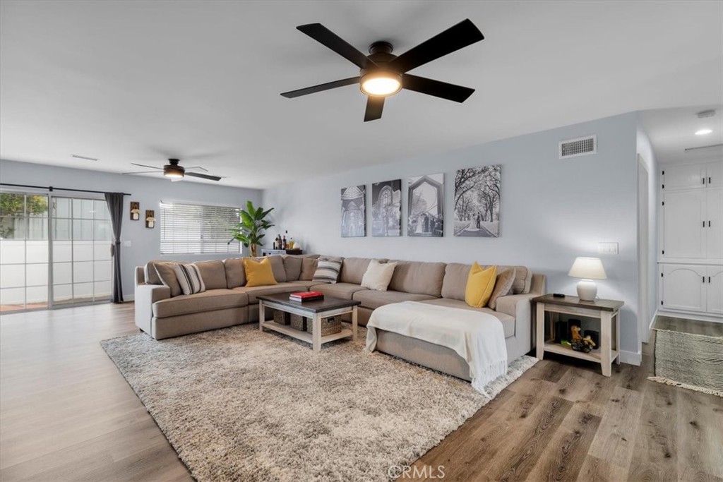 338 East 219th Street Carson, CA 90745 - Photo 10 of 36 a living room with furniture and a fireplace