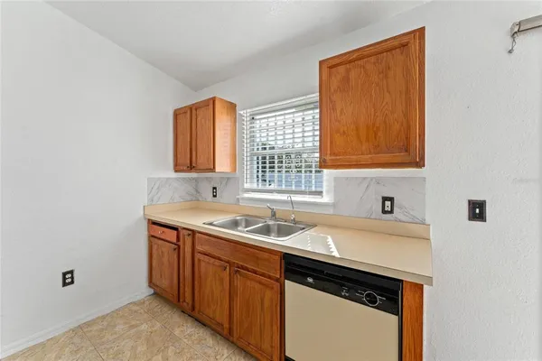a utility room with a sink a washer and dryer