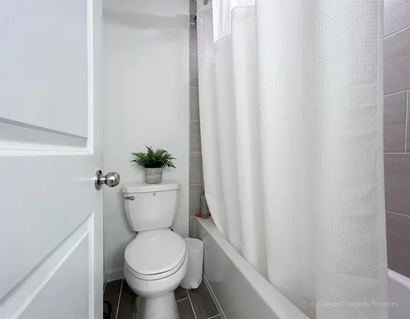 a bathroom with a toilet and a sink