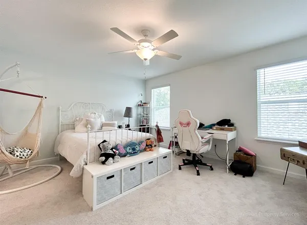 a bed room with furniture and a window