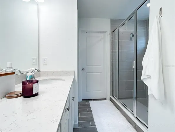 a bathroom with a tub and shower