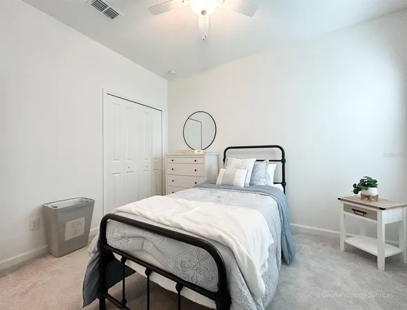 a bedroom with a bed a desk and chair