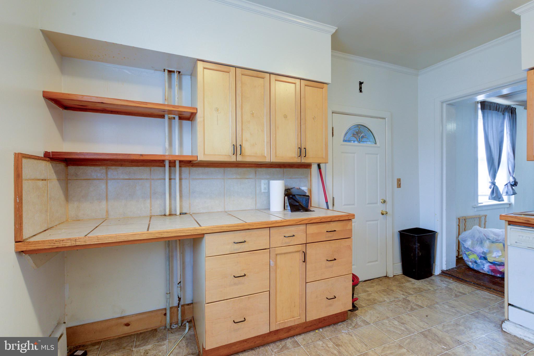 15 7th Street Brookhaven, PA 19015 - Photo 11 of 33 a kitchen with cabinets and window