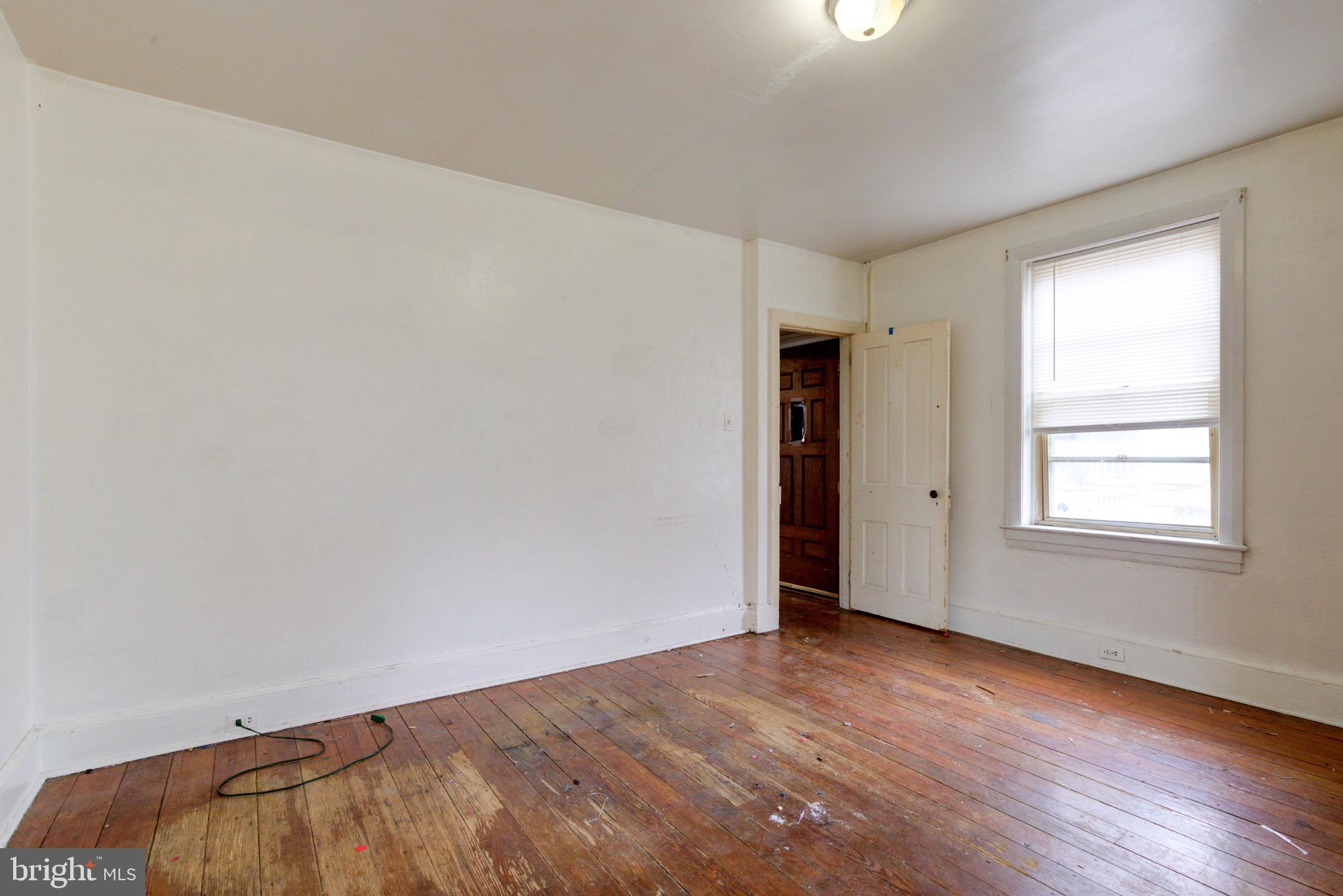 15 7th Street Brookhaven, PA 19015 - Photo 15 of 33 an empty room with wooden floor and windows