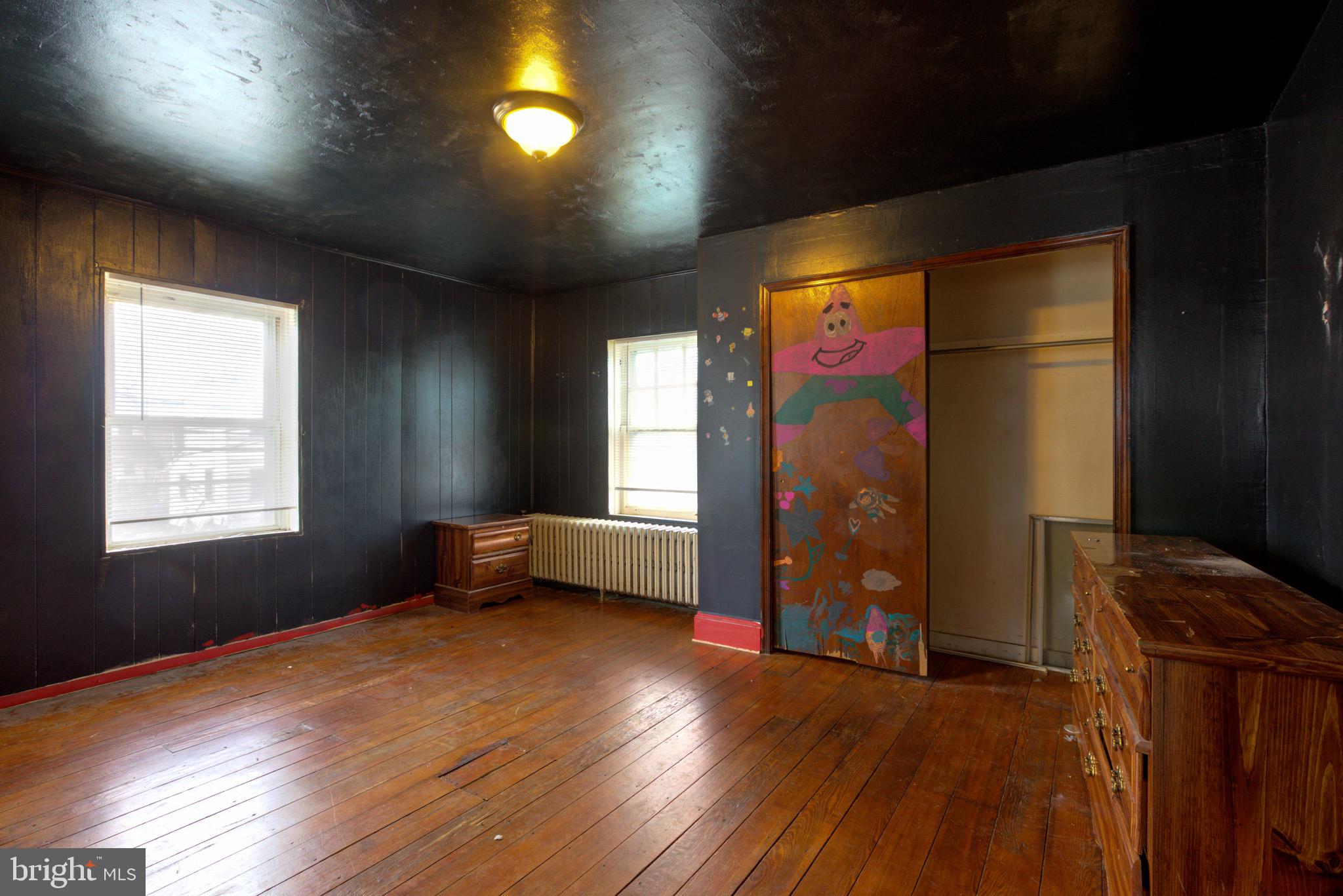 15 7th Street Brookhaven, PA 19015 - Photo 16 of 33 a view of empty room with wooden floor and fan