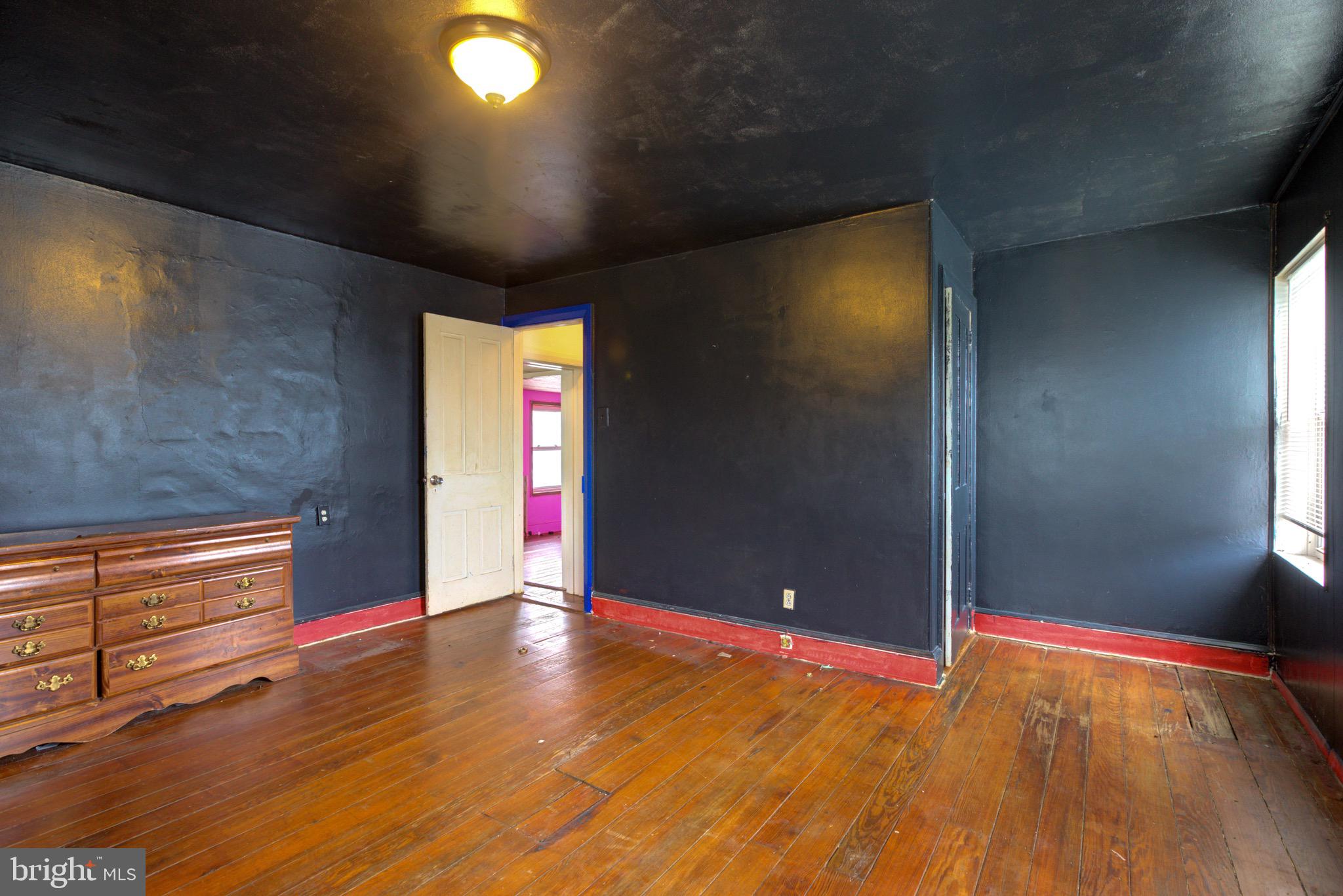15 7th Street Brookhaven, PA 19015 - Photo 17 of 33 a view of an empty room with window and wooden floor