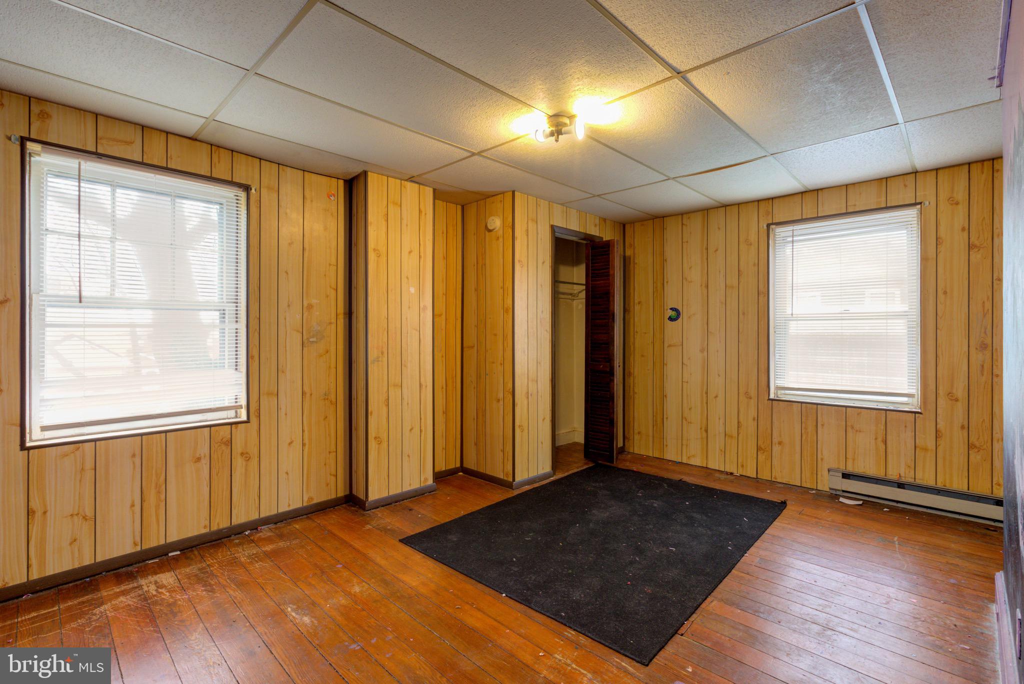 15 7th Street Brookhaven, PA 19015 - Photo 18 of 33 wooden floor in an empty room with a window