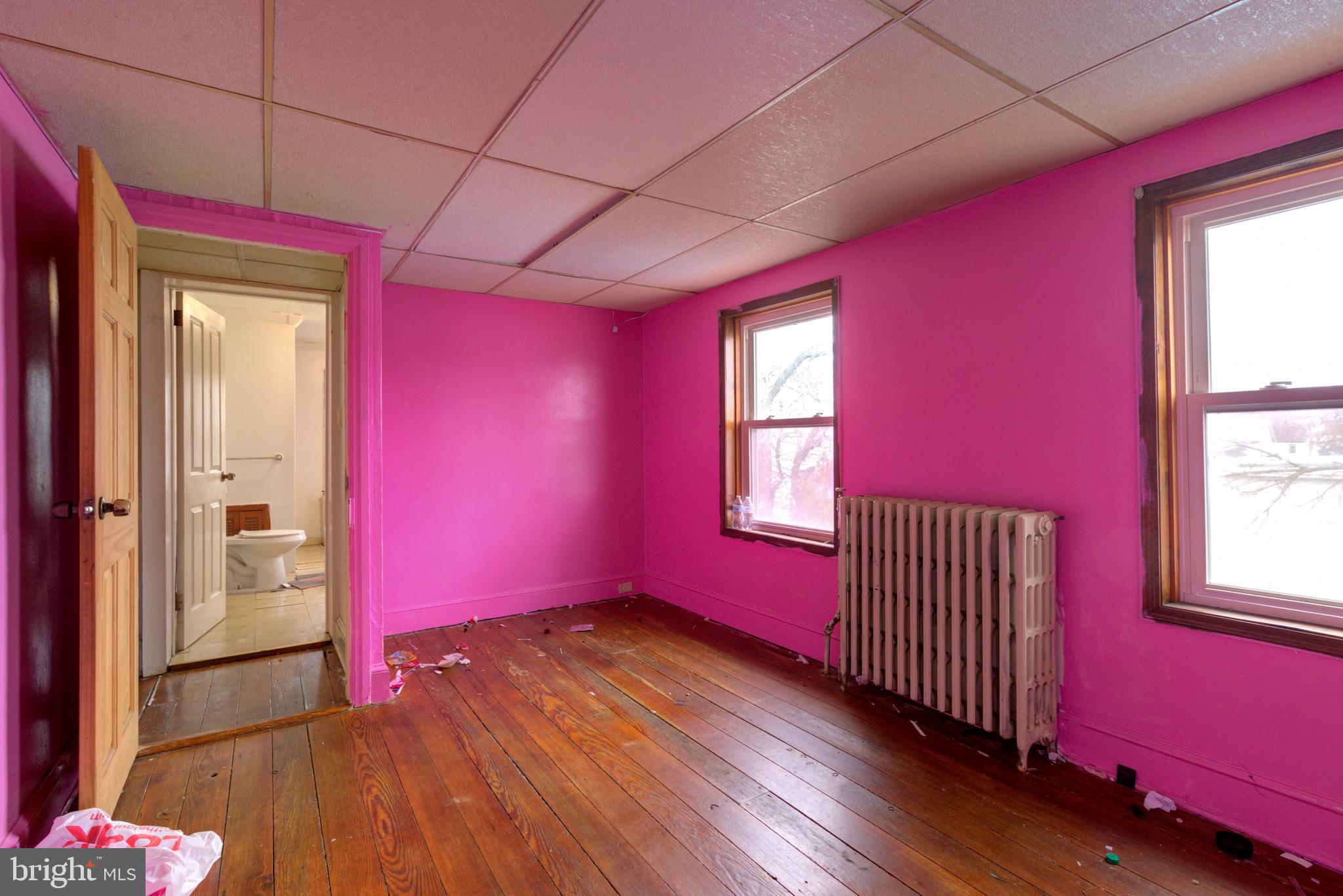15 7th Street Brookhaven, PA 19015 - Photo 21 of 33 a view of empty room with wooden floor and fan