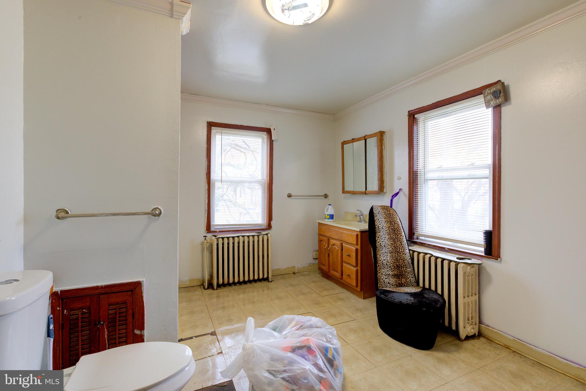 15 7th Street Brookhaven, PA 19015 - Photo 22 of 33 a bathroom with a sink a toilet and tub