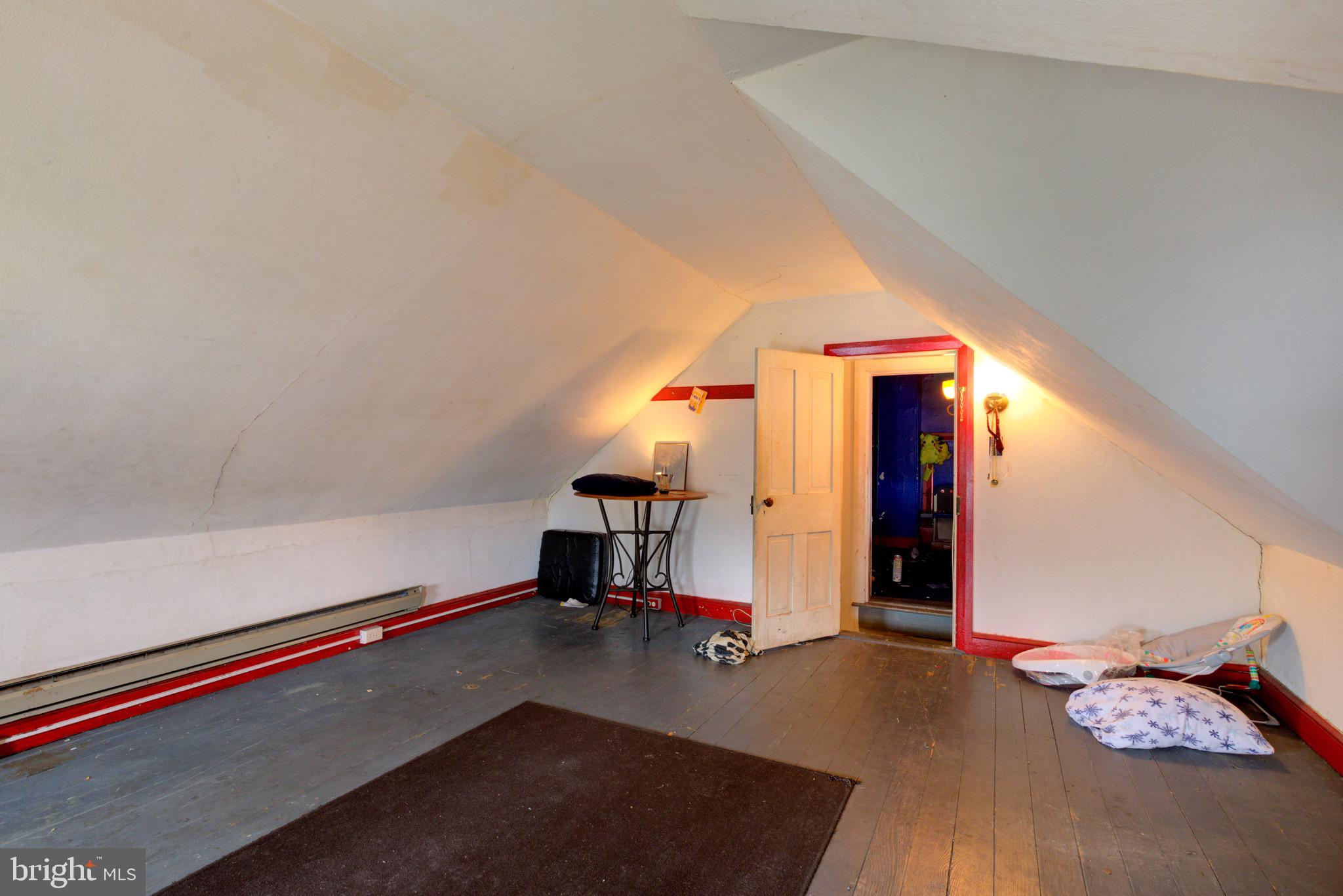 15 7th Street Brookhaven, PA 19015 - Photo 25 of 33 a view of empty room with stairs and couch