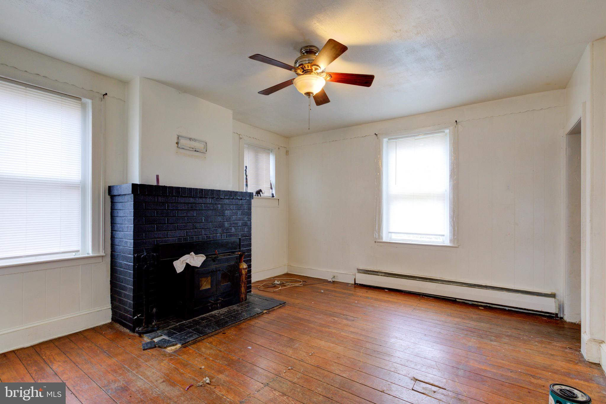 15 7th Street Brookhaven, PA 19015 - Photo 6 of 33 a living room with furniture and a fireplace