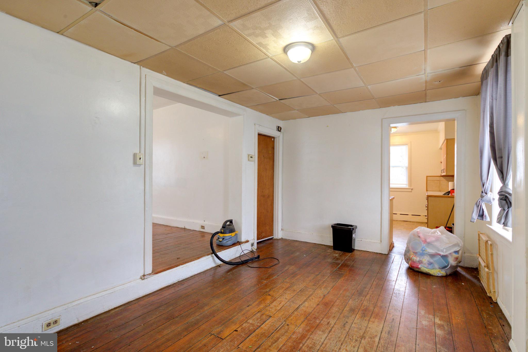 15 7th Street Brookhaven, PA 19015 - Photo 8 of 33 a view of room with wooden floor and lounge chair