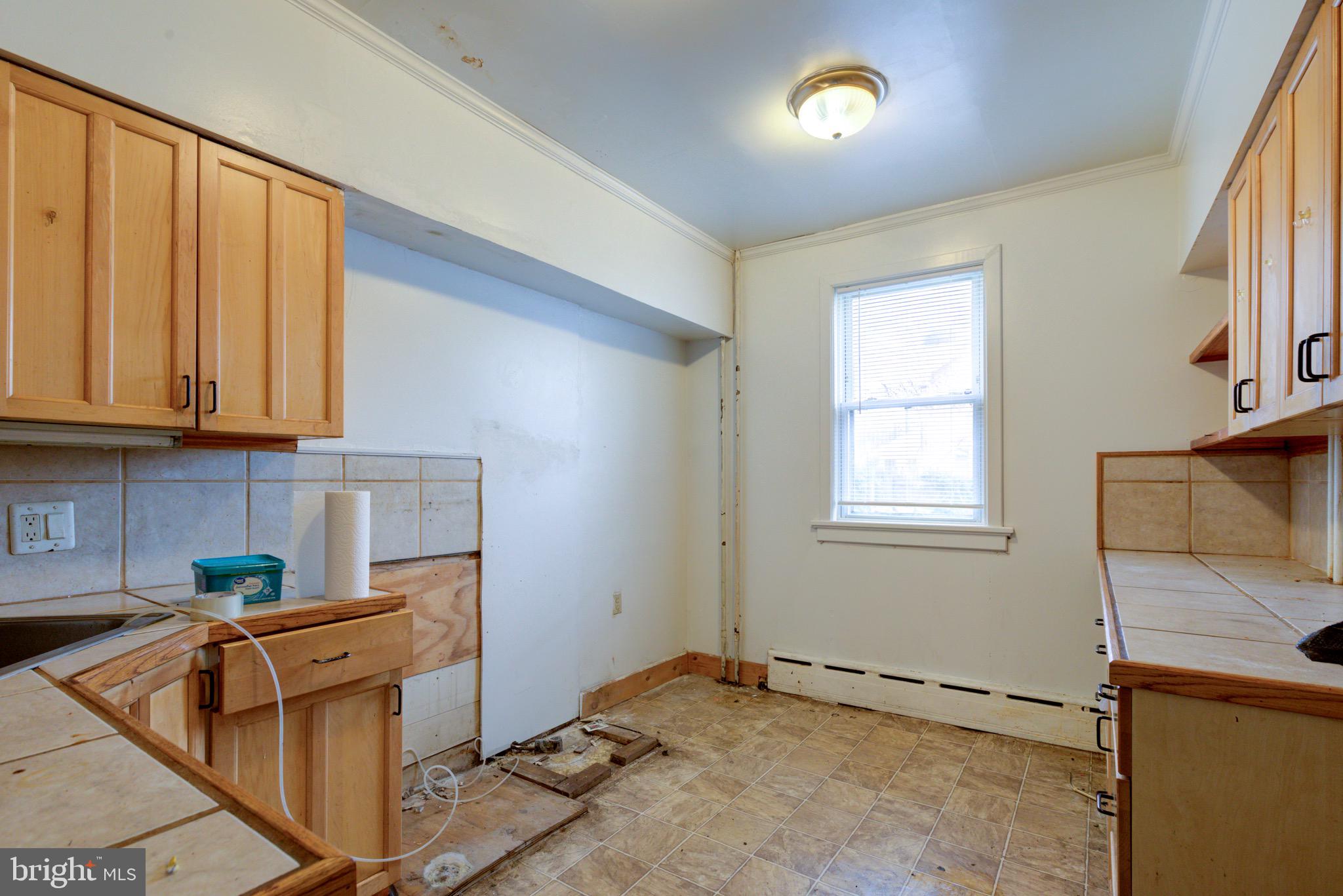 15 7th Street Brookhaven, PA 19015 - Photo 9 of 33 a view of a kitchen with furniture and a window
