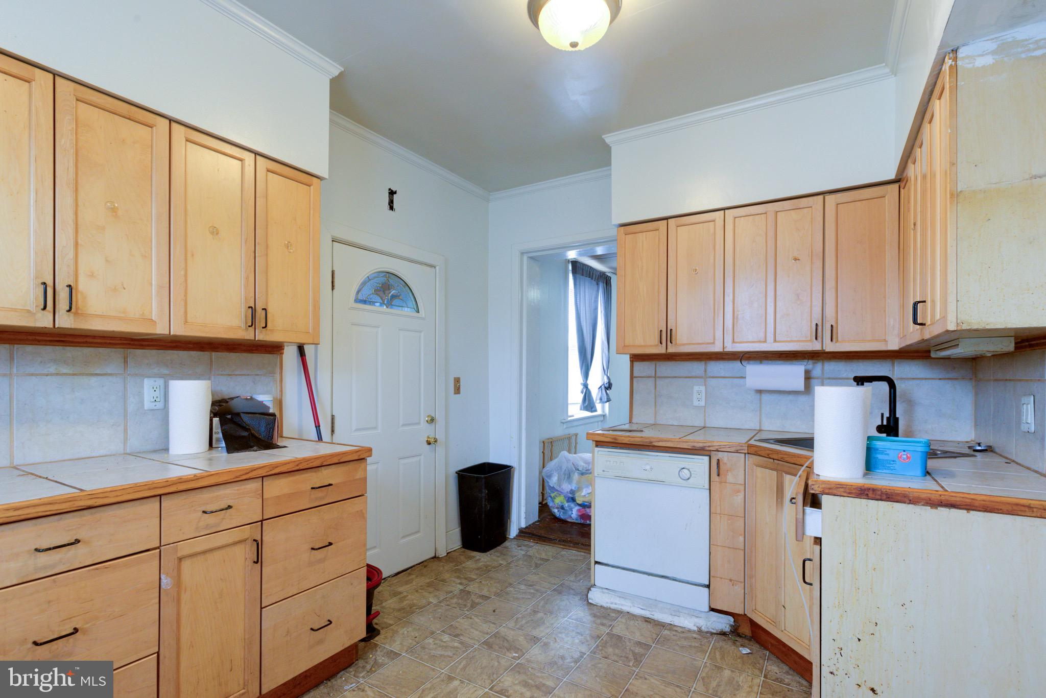 15 7th Street Brookhaven, PA 19015 - Photo 10 of 33 a kitchen with white cabinets and white appliances