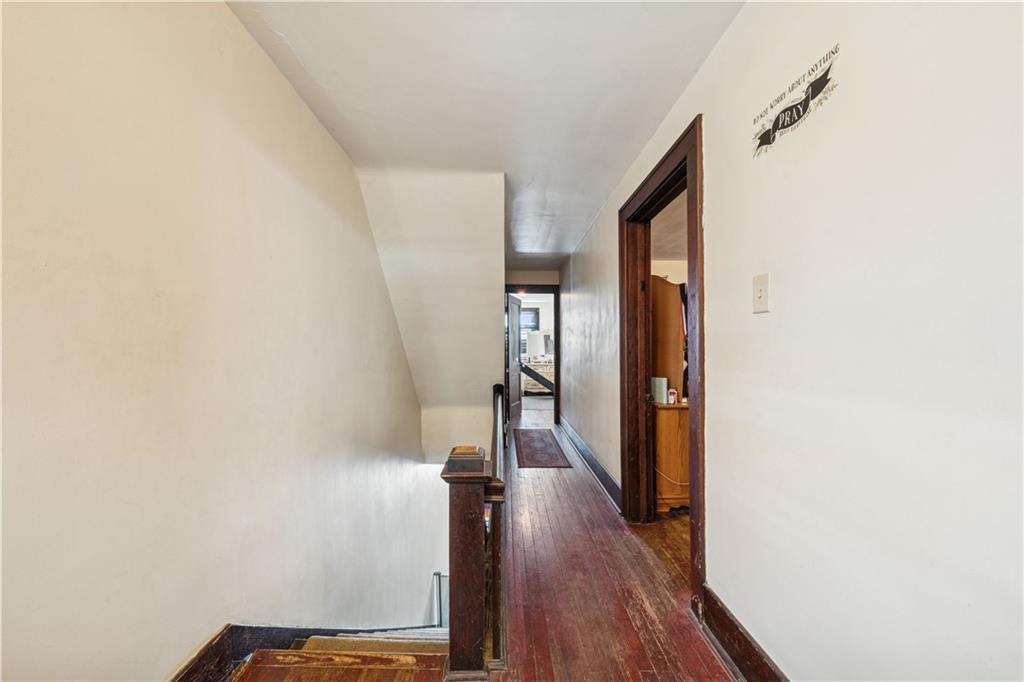 421 Freeport Road Creighton, PA 15030 - Photo 11 of 25 a view of a hallway with wooden floor and staircase