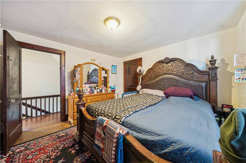 421 Freeport Road Creighton, PA 15030 - Photo 13 of 25 a bedroom with furniture and wooden floor