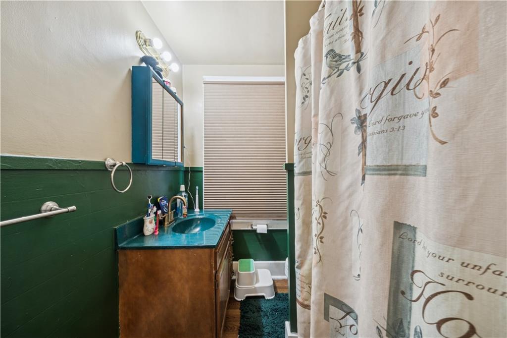421 Freeport Road Creighton, PA 15030 - Photo 20 of 25 a bathroom with a granite countertop sink and a mirror