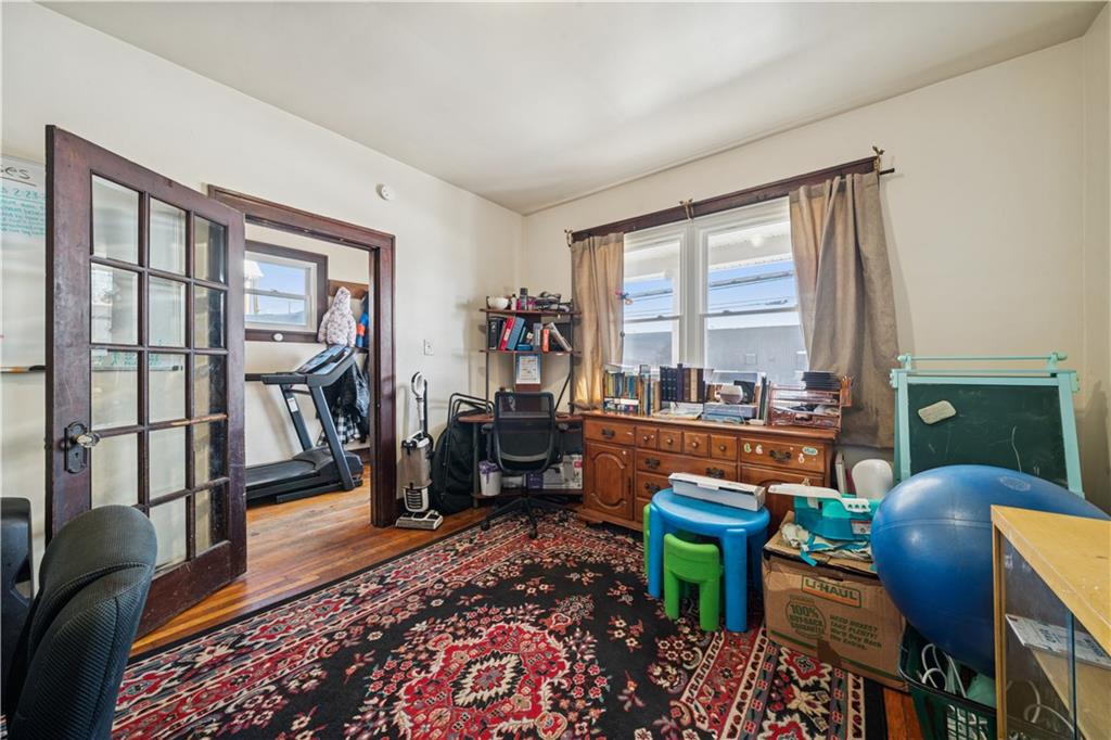 421 Freeport Road Creighton, PA 15030 - Photo 21 of 25 a living room with furniture and a floor to ceiling window