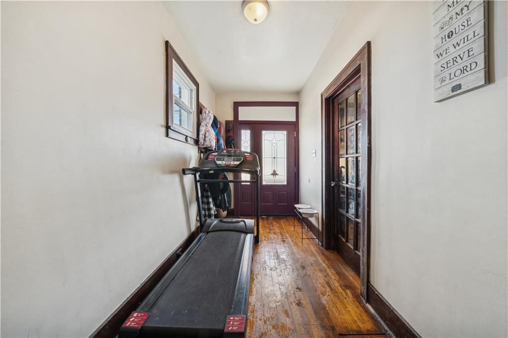 421 Freeport Road Creighton, PA 15030 - Photo 4 of 25 a view of a hallway with wooden floor and staircase