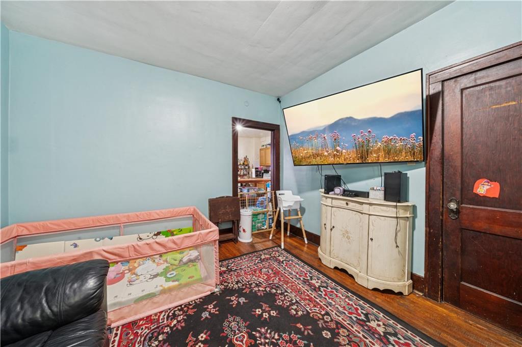 421 Freeport Road Creighton, PA 15030 - Photo 9 of 25 a room with a bed and a flat screen tv