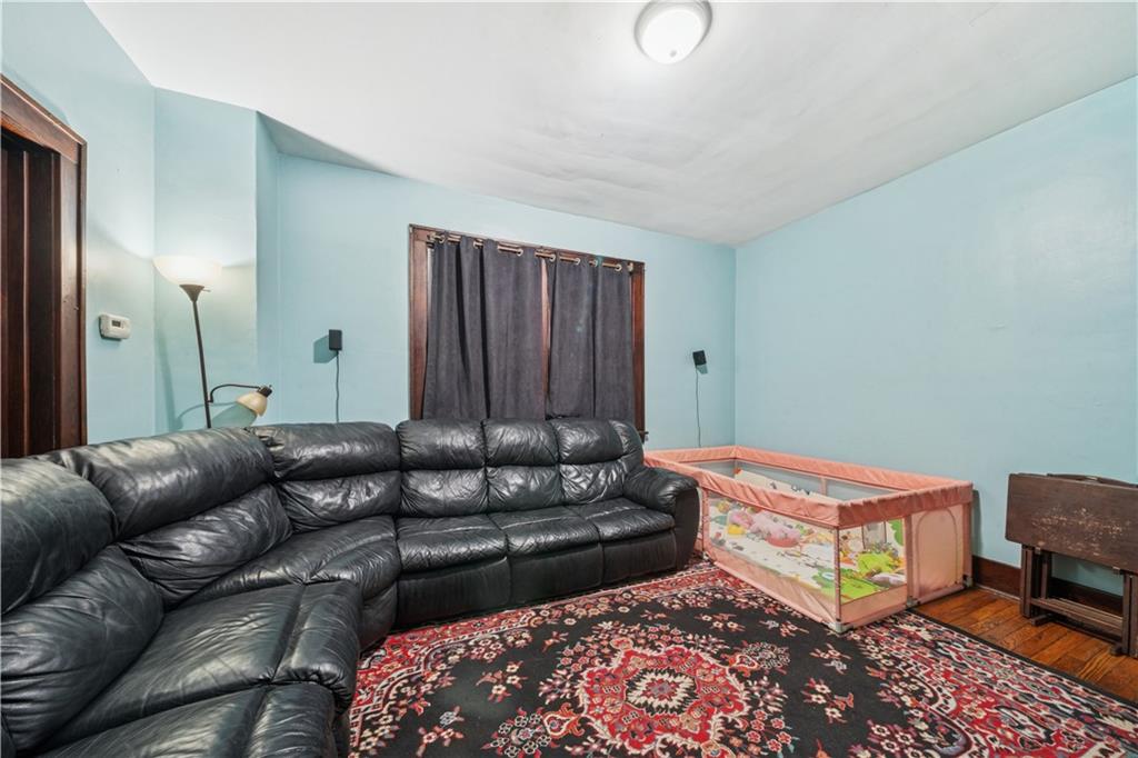 421 Freeport Road Creighton, PA 15030 - Photo 10 of 25 a living room with furniture and a rug