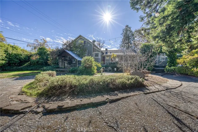 a view of a street with a building in the background