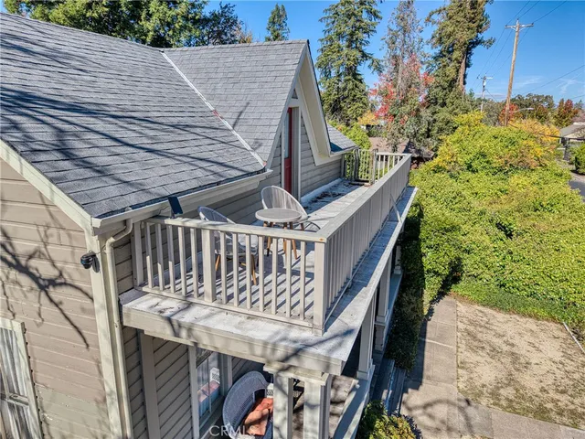 an aerial view of multiple houses with yard