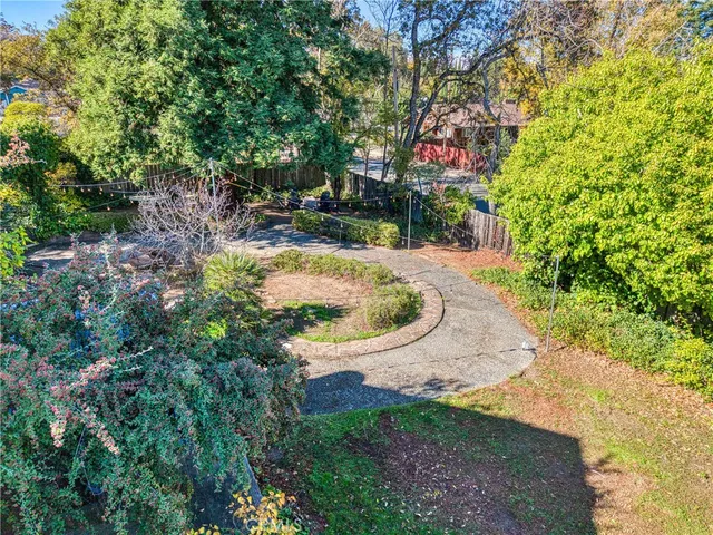 a bed room with a bed and a chandelier