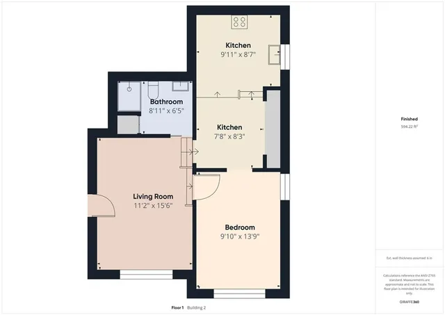 a view of a kitchen with a table and chairs in it