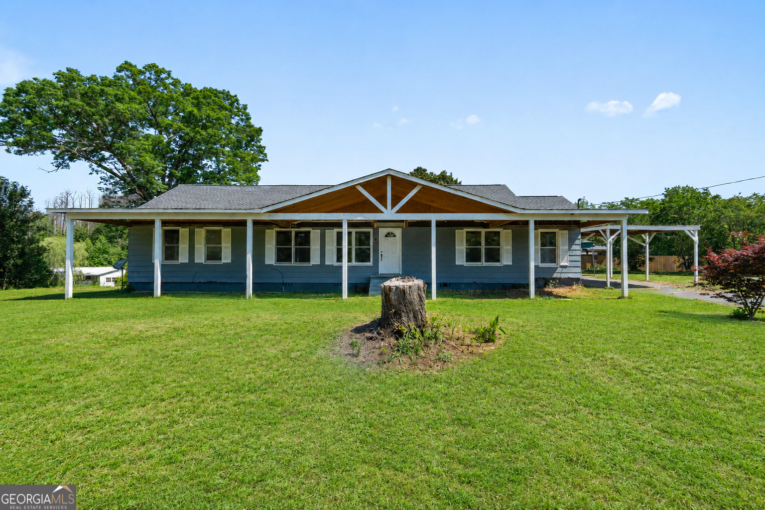 49 Frost Road Bowdon, GA 30108 - Photo 2 of 60 a front view of a house with a garden