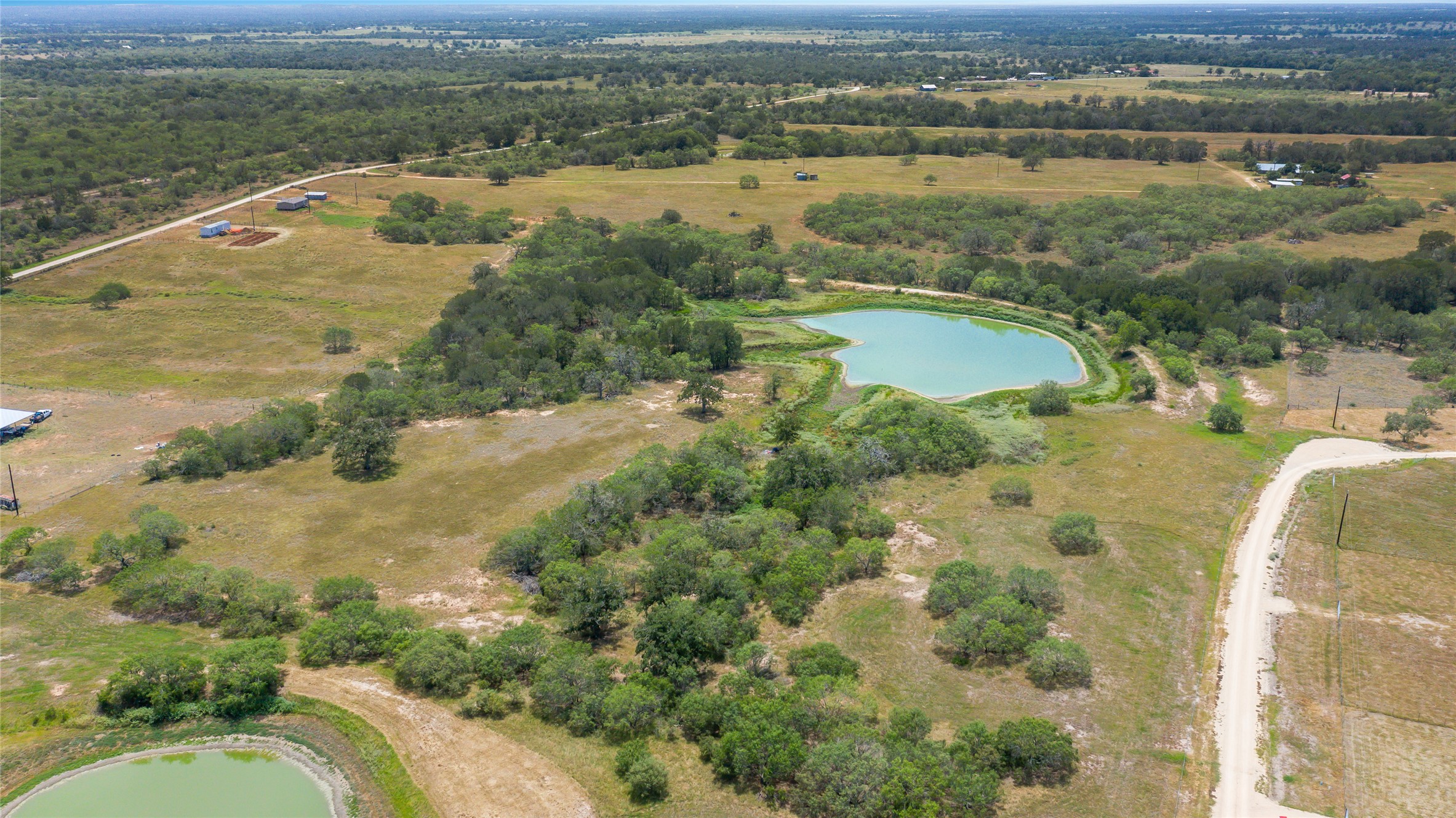 736 Cr 421 Road Waelder, TX 78959 - Photo 4 of 9 Aerial overview of property's location with a nearby body of water and rural landscape
