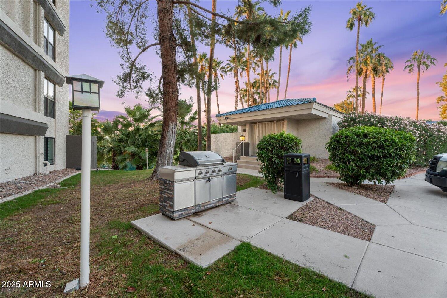 5122 North 31st Way, Unit 221 Phoenix, AZ 85016 - Photo 30 of 41 a white house with trees in front of it