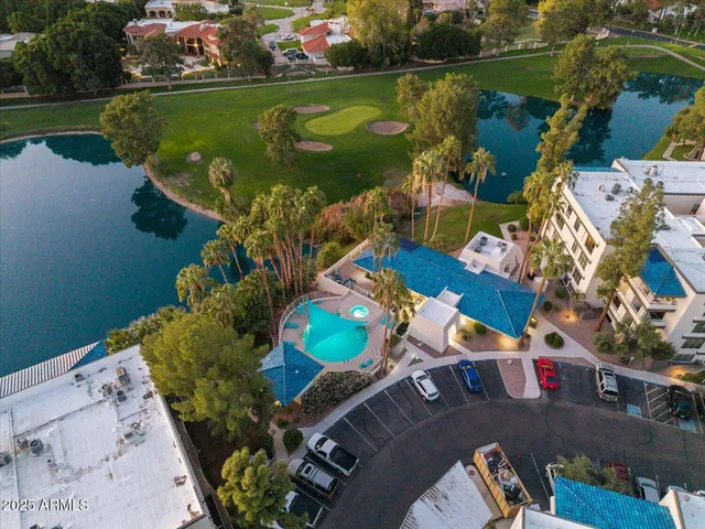 an aerial view of a house with a lake view
