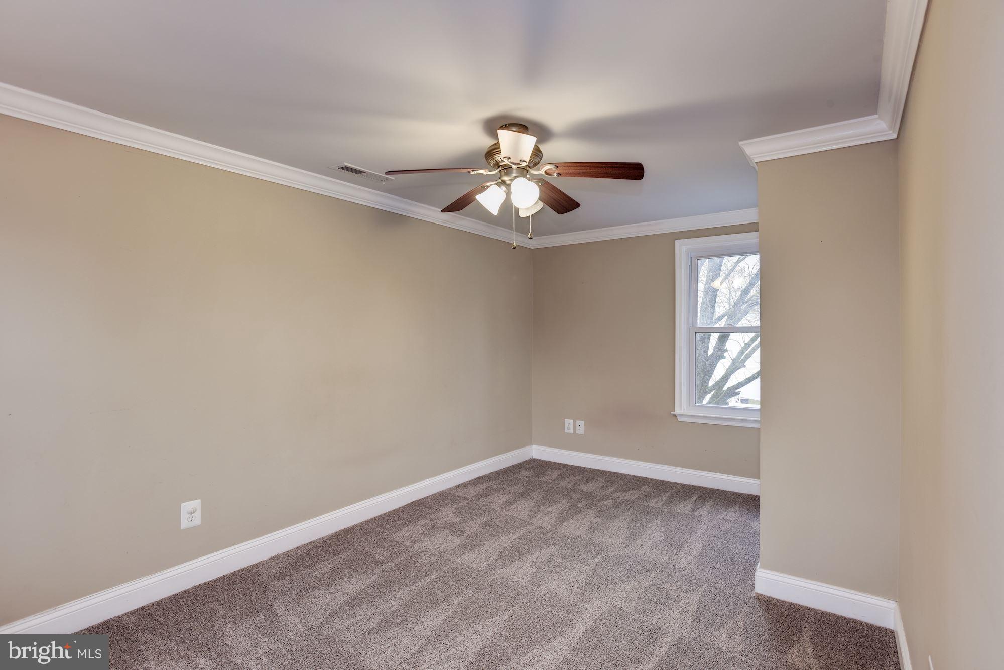 3220 Rolling Rd. Baltimore, MD 21244 - Photo 25 of 28 wooden floor in an empty room with a window
