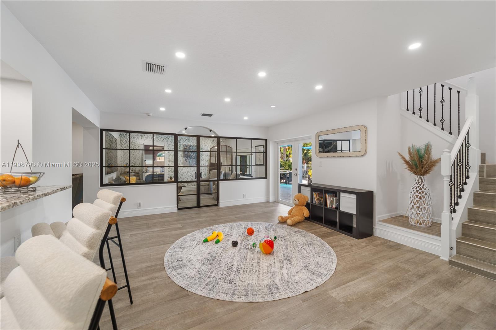 4011 Northeast 26th Avenue Lighthouse Point, FL 33064 - Photo 15 of 35 a living room with furniture and a table