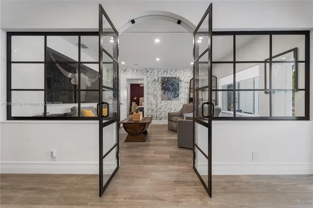 a kitchen with stainless steel appliances kitchen island granite countertop a stove and a refrigerator