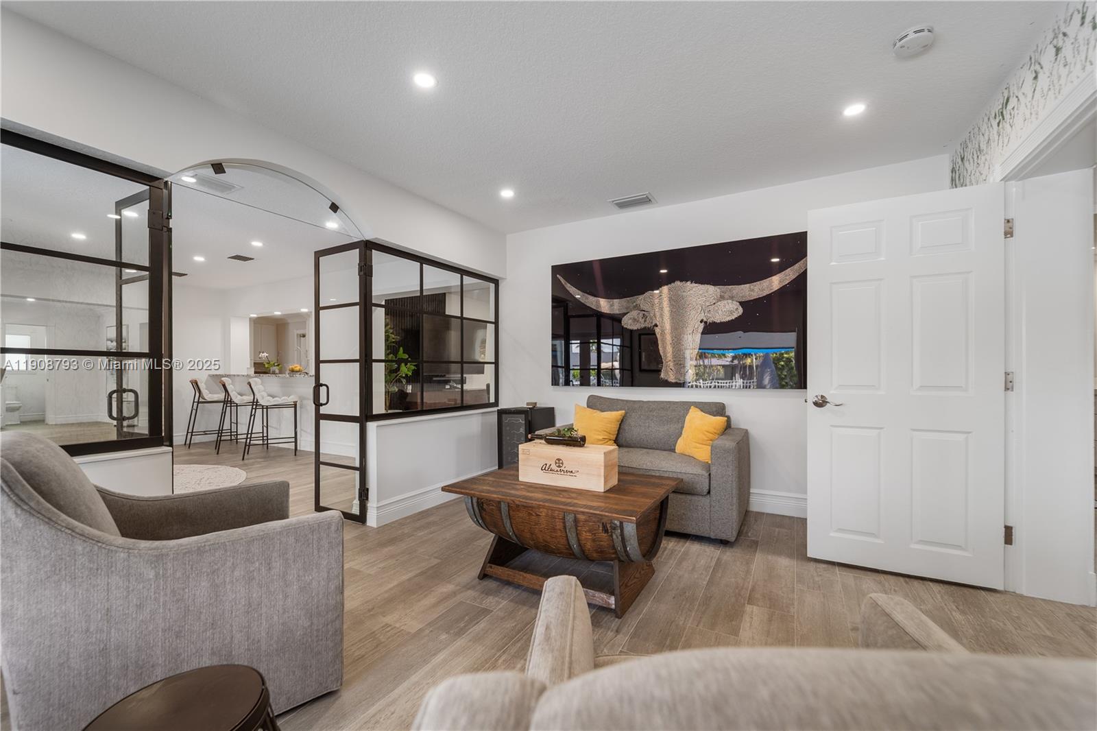 4011 Northeast 26th Avenue Lighthouse Point, FL 33064 - Photo 17 of 35 a living room with furniture and a glass door
