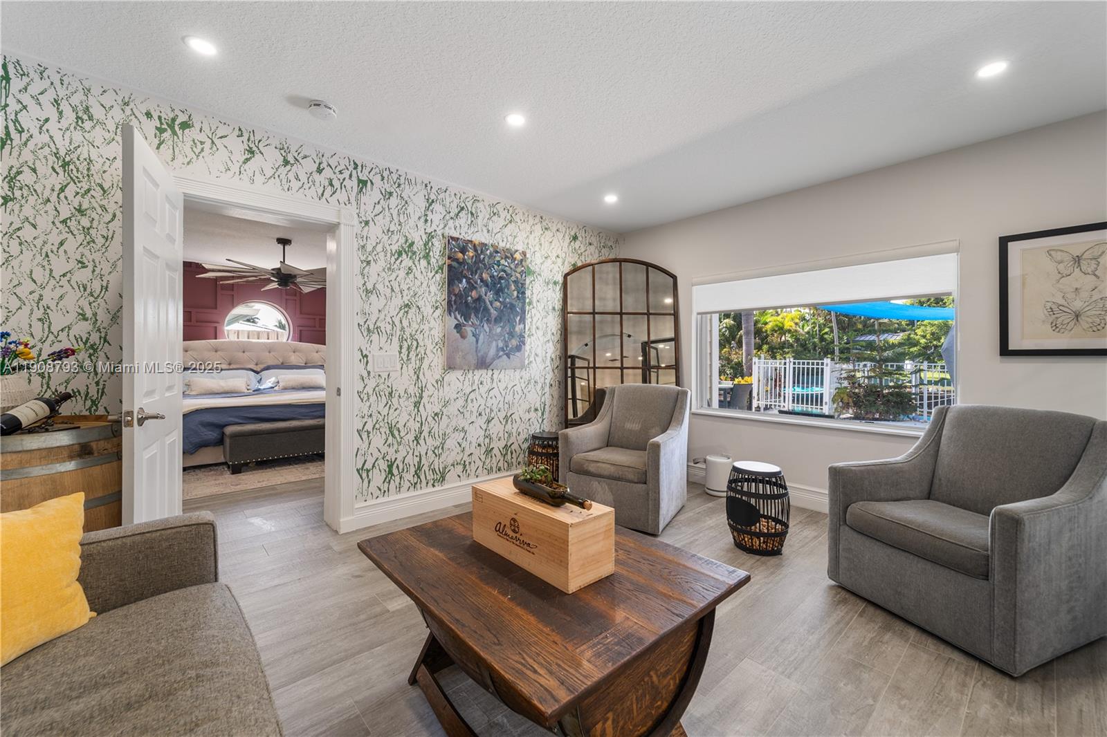 4011 Northeast 26th Avenue Lighthouse Point, FL 33064 - Photo 18 of 35 a living room with furniture and a large window