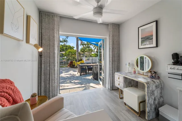 a living room with furniture a fireplace and a window